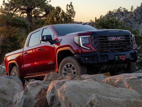2025 GMC Sierra 1500 driving over large rocks
